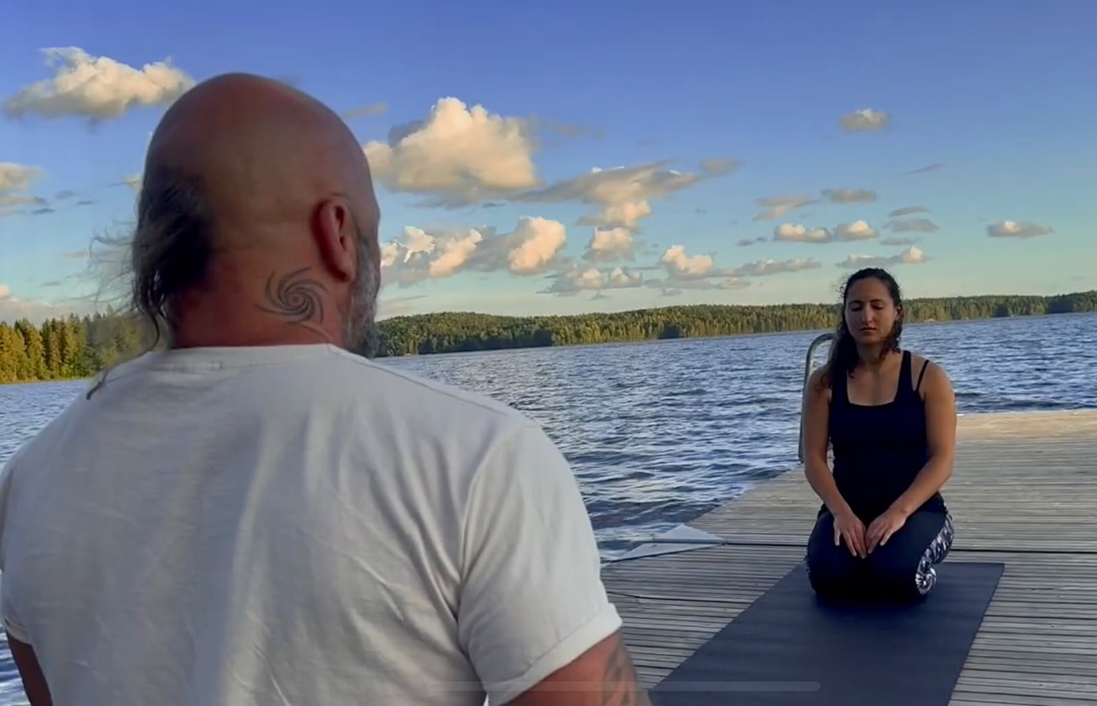 Renzo guiding a personal meditation practice beside a lake